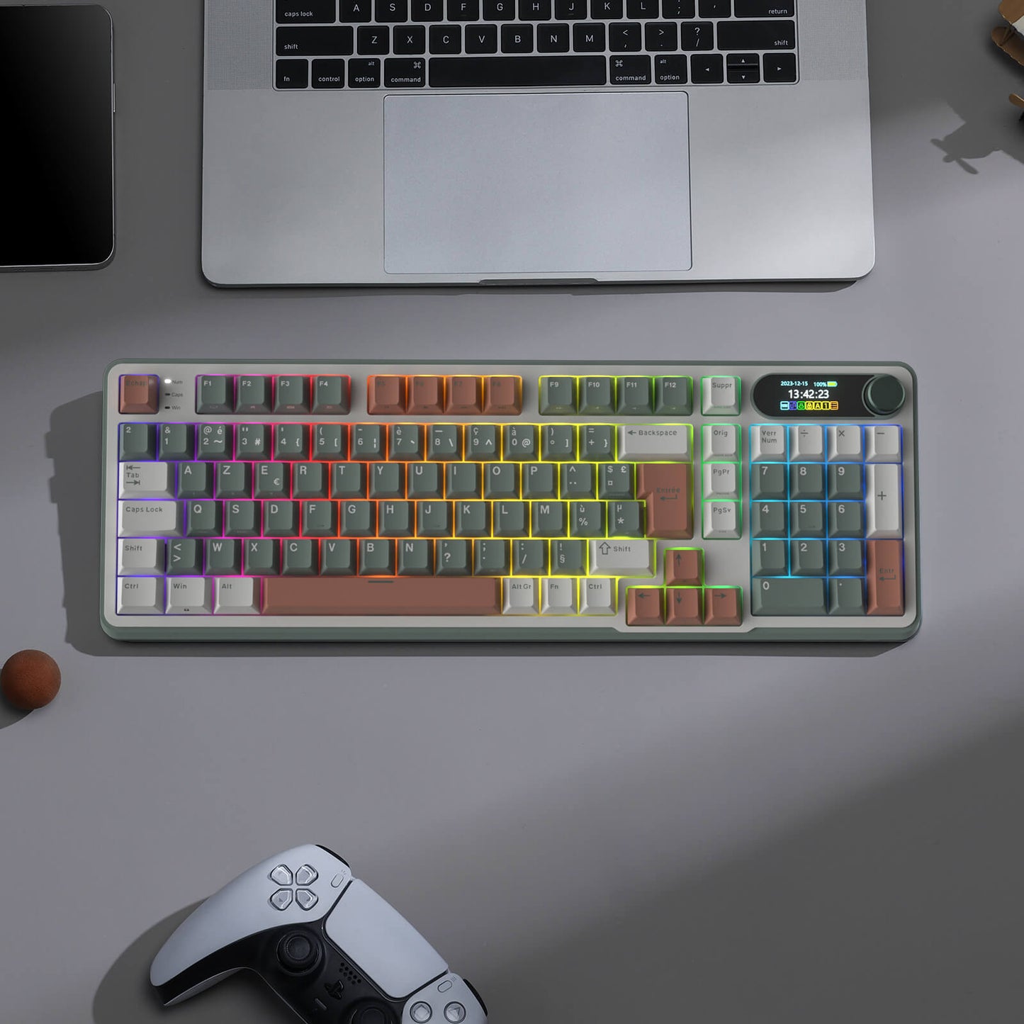 S98 Mechanical keyboard with colorful keycaps on a desk next to a laptop and gaming controller.