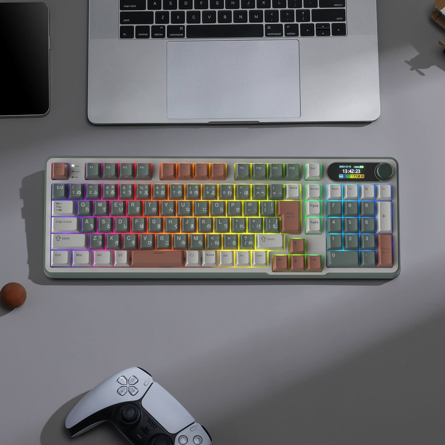 RK S98 RGB Colorful mechanical keyboard on a desk with a laptop and gaming controller.