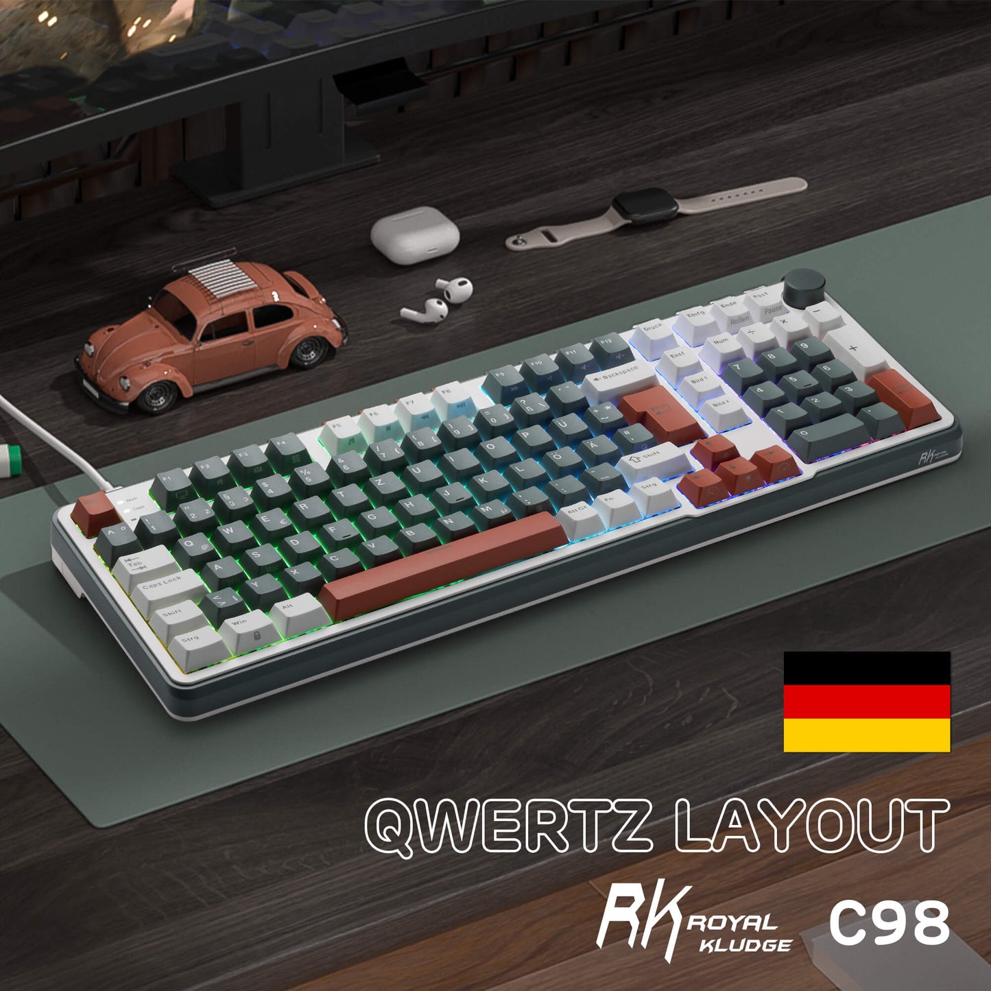 RK C98 Mechanical keyboard with QWERTZ layout on a desk with small items