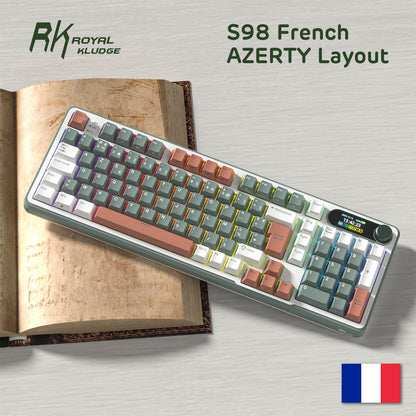 RK Royal Kludge S98 French AZERTY layout keyboard on a wooden surface with a book