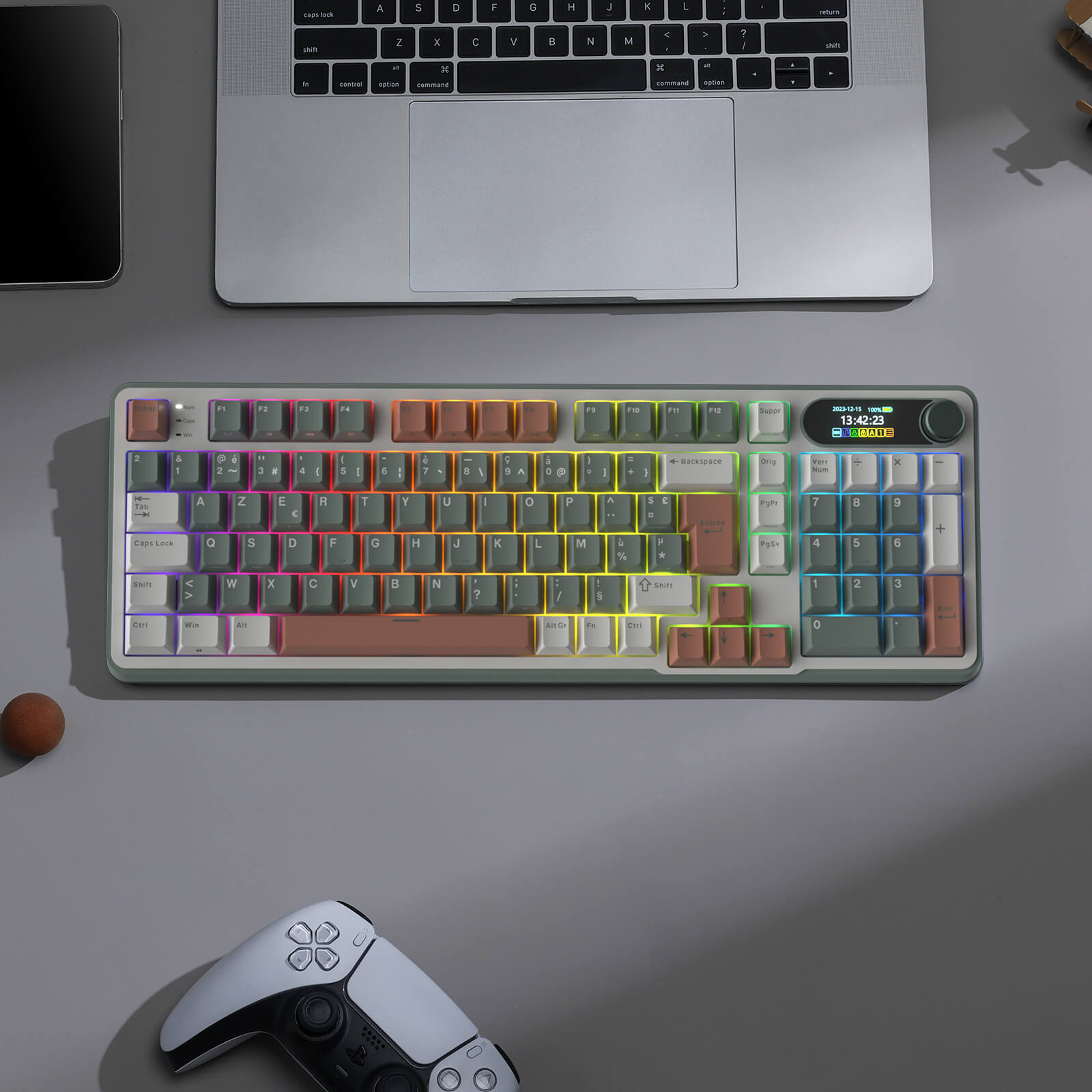 S98 Mechanical keyboard with colorful keycaps on a desk next to a laptop and gaming controller.